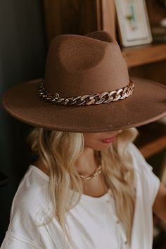 Top off your fall wardrobe in the best and most stylish way with our chic iced latte colored 'Love Of Lattes hat featuring soft lightweight felt material, a wide 4-inch brim, and a large gold chain link accent band! Length: 15.5 inches Width: 14.5 inches Height: 5 inches Cranial Circumference: 22.5 inches Chic Brown Winter Hats, Chic Brown Felt Hat For Winter, Chic Brown Felt Hat For Beach, Chic Brown Felt Hat For The Beach, Chic Brown Hat For Fall, Chic Brown Fall Hat, Elegant Brown Felt Sun Hat For Beach, Chic Brown Fedora With Curved Brim, Chic Brown Brimmed Fedora