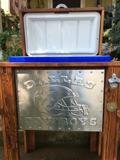 an ice chest on display in front of a building with the name detroit football written on it