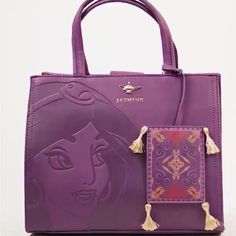 My Purse Is Basically New Was A Gift And I Really Don’t Use These Kind Of Bags It Has Not Been Used At All.. This Stunning Plum Purse Is Befitting For The Dark Hues Of Fall. It Features An Embossed Illustration Of Princess Jasmine, Along With A Jasmine Gold Genie Lamp Brand Logo. Also, A Nice Large Pin! If It Wasn’t For Aladdin’s Magic Carpet, Jasmine Would Forever Be Tucked Away In Her Turret, Locked Away From The Many Treasures And Charms Of The Abyss, And Thus, This Purse Features A Magic Car Disney Bags And Purses, Disney Purses And Handbags, Disney Bags For Daily Use, Daily Disney Style Bag, Disney Rectangular Shoulder Bag For Everyday Use, Shopping Tote Bag With Case Included, Disney Rectangular Shoulder Bag For Daily Use, Disney Style Gift Bag, Rectangular Shape, Disney Rectangular Shoulder Bag For Travel