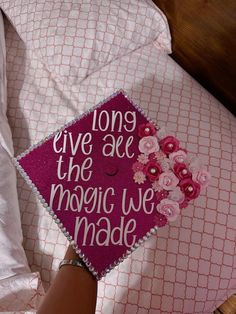 a graduation cap that says long live the magic we made on top of a pillow