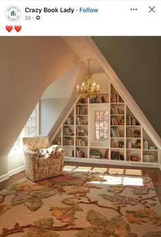 a room with a chair, bookshelf and chandelier in it