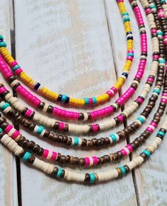 Choose a pretty boho necklace from numbers 1-6   * All measure 16" * 4mm pink, turquoise, cream heishi beads with multicolored polymer clay and golden spacer beads make up these gorgeous summer necklaces. The beads are imitation turquoise, same weight, fraction of the cost and just as beautiful 😍  Lobster Clasp Fastening *please note as these are added back to stock the gold beads may be slightly different to the original (but just as gorgeous 👉Follow me @Bohoseason  on Facebook & Instagram  A Bohemian Heishi Letter Beads, Handmade Pink Heishi Beads Necklace, Pink Heishi Bead Necklace With Colorful Beads, Bohemian Heishi Bead Necklace With Wooden Details, Bohemian Turquoise Beaded Necklace With Letter Beads, Bohemian Necklace With Wooden Heishi Beads, Pink Necklace With Colorful Heishi Beads, Pink Bohemian Heishi Beads, Bohemian Pink Heishi Beads