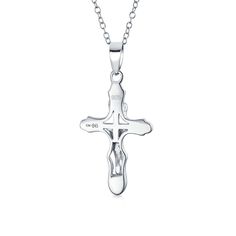 Introducing our exquisite .925 Sterling Silver Jesus Christ Crucifix Cross Pendant, a true masterpiece of art and faith. This silver cross showcases unparalleled detail and craftsmanship, making it a truly remarkable piece of jewelry. Perfect for religious holidays, special family gatherings, and spiritual milestones, this cross necklace is an ideal gift. Its elegant and polished design allows it to be effortlessly paired with other favorite pendants, creating a stunning and personalized look. Symbolic, meaningful, and always classic, cross pendants never go out of style. Purchase our cross pendant necklace today and embrace a striking, modern, and timeless aesthetic. Please note that an 18 Inch Chain is included with this item. Necklace Stand, Silver Cross Pendant, Modern Necklaces, Engraved Jewelry, Religious Jewelry, Cross Pendant Necklace, Silver Cross, Bling Jewelry, Necklace Sizes