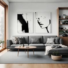 a living room with two paintings on the wall