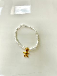 This bracelet is made out of stretchy string and seed beads. It's so adorable for summer  and will match almost any outfit! All orders will recieve 2 stickers and a ring for free. Bracelet Inspo, Summer Bracelet, Starfish Bracelet, Rose Bracelet, Summer Bracelets, So Adorable, Beaded Rings, Free Stickers, Starfish