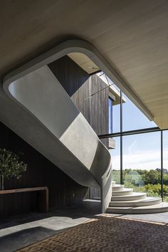 an unusual staircase in front of a large window