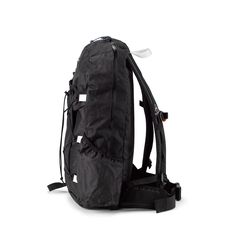 a back pack with straps on the bottom and an attached backpack strap to the side