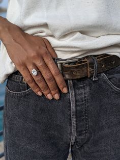 a close up of a person wearing a ring