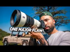 a man holding a camera up to his face with the words one major flav on it