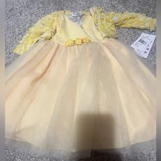 Yellow New Baby Girl Dress. Size 12 Months Long Sleeve Tutu Dress For Spring Dress-up, Long Sleeve Tutu Dress For Dress-up In Spring, Cute Long Sleeve Princess Dress For Baptism, Fitted Yellow Princess Dress For Spring, Spring Long Sleeve Dresses For Playtime, Long Sleeve Dresses For Playtime In Spring, Long Sleeve Dresses For Spring Playtime, Cute Long Sleeve Baptism Dress, First Birthday Princess Dress With Long Sleeves