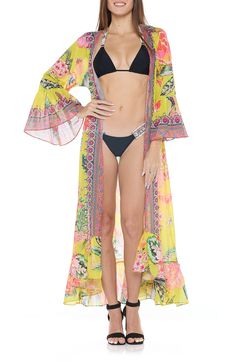 A vivid floral print brightens a vacation-ready cover-up crafted in a longline duster silhouette with ruffle sleeves from lightweight fabric. 52" length (One size) Open front Three-quarter sleeves 100% polyester Hand wash, dry flat Imported Yellow Long Sleeve Swimwear For Spring, Spring Bohemian Kimono For Poolside, Bohemian Printed Swimwear For Spring, Bohemian Kimono For Poolside In Spring, Spring Floral Print Swimwear For Beach, Spring Yellow Cover-up For Beach Party, Spring Multicolor Cover-up For Beach Party, Bohemian Swimwear With Tropical Print For Spring, Yellow Spring Cover-up For Beach Party