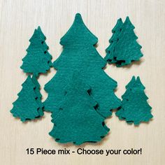 green felt christmas trees are shown on a wooden surface with the words 15 piece mix - choose your color