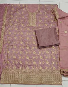 Designer Party Wear Dola Jacquard Pakistani Suit Collection Processing Time : 20-25 Working Days Work : Mauve Floral Embroidered Straight Cut Suit Fabric:Top : Dola Jacquard Bottom : Dull Santoon Dupatta : Silk Color:Top : Mauve Bottom : Mauve Dupatta : Mauve Note : Blue colored pakistani suit is prettified with thread work as shown which makes it appear classy. This top is made of georgette fabric which is accompanied with santoon bottom, santoon lining and Georgette dupatta. Women can buy this Semi-stitched Brocade Palazzo Set, Festive Brocade Palazzo Set With Resham Embroidery, Gold Silk Sets With Chikankari Embroidery, Festive Semi-stitched Brocade Palazzo Set, Fitted Gold Palazzo Set With Chikankari Embroidery, Pink Chanderi Palazzo Set For Celebration, Brocade Palazzo Set For Festivals, Elegant Pink Jamawar Churidar, Festive Anarkali Sets In Brocade