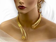 Indulge in the allure of modern elegance with our Handmade Gold Plated Choker Collar Necklace. Crafted with meticulous attention to detail, this stunning piece exudes sophistication and style. The open design of the collar necklace adds a touch of contemporary flair, making it the perfect accessory for any occasion. Each necklace is expertly plated in luxurious gold, adding a radiant glow to your neckline. Its versatile design allows for effortless pairing with both casual and formal attire, add Gold Evening Choker Jewelry, Gold Choker For Evening, Party Jewelry With Unique Metal Variations, Elegant Round Choker As Gift, Elegant Round Choker For Gifts, Elegant Yellow Gold Choker For Gift, Gold Adjustable Jewelry For Evening, Adjustable Gold Jewelry For Evening, Elegant Metal Choker For Wedding