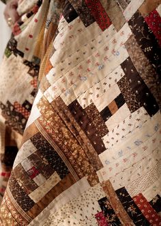 a close up of a person wearing a quilt