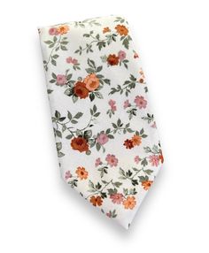 "This brown floral necktie, and bowtie are perfect for any special occasion.  The regular necktie is 3.5 inches wide and 59 inches long.  The skinny necktie is 2.5 inches wide and 59\" long." White Standard Tie For Black Tie Events, White Necktie For Gift, White Standard Tie For Gift, White Standard Tie As Gift, White Pocket Square For Black Tie Events, Dapper White Suit And Tie Accessories For Summer, White Floral Print Tie For Formal Occasions, Classic Floral Print Ties, Formal White Suit And Tie Accessories With Floral Print