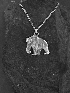 "This Polar Bear pendant is Sterling Silver. The included chain is a Sterling Silver Figaro 50 chain. You may choose 16, 18 or 20 inch at the same price. Other length available at sightly higher prices. This Polar Bear pendant measures 1 1/4\" tall by 1 1/4\" across. I hand cast all my pieces using the lost wax casting method. Please ask your needs. You may call me with questions, often I am out so please use my machine. 831-476-3176. Satisfaction Guaranteed! I send items USPS First Class unless Animal Pendant, Bear Pendant, Wax Casting, Lost Wax Casting, Sterling Silver Cross, Lost Wax, Hand Cast, Sterling Silver Chain, Polar Bear