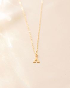 Letter necklace, Initial necklace, Gold initial necklace, Minimal initial necklace, Tiny initial necklace, Name necklace, Gold letter --- Stun in this personalized dainty gold filled mini Letter Necklace and you'll never want to take it off. Details: -Gold Filled, Sterling Silver -8mm Letter -Waterproof, Tarnish Resistant, Hypoallergenic -Length 18" Letter Necklace Initials, Gold Initial Necklace, Name Necklace Gold, Necklace Name, Necklace Initial, Gold Letter, Initial Necklace Gold, Gold Initial, Wedding Jewellery Necklace