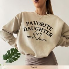 Get yourself this comfy crewneck sweatshirt. The perfect Daughter sweatshirt to give a Daughter and Sister. Gift this Favorite Daughter Sweatshirt to someone important in your life.   📣MATERIAL GILDAN 18000 Medium-heavy fabric (8.0 oz/yd² (271.25 g/m Loose fit Runs true to size 50% cotton, 50% polyester Sewn-in label Without side seams Ribbed knit collar with seam  📣DESIGN/PRINTING We use DTG (Direct To Garment) Printing which ensures the highest quality of details, color, and durability.  📣C Denim Jacket With Hoodie, Comfy Crewneck, Favorite Daughter, A Daughter, Average Weight, Limassol, Daughter Gifts, Pink Sweatshirt, Sew-in Labels