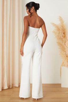 From the bridal shower to the rehearsal dinner, there are plenty of places to wear the Lulus Adoring Occasion White Strapless Wide-Leg Jumpsuit! All eyes are bound to stay on you thanks to this stunning jumpsuit that has a stretchy crepe knit composition that shapes a straight neckline and a strapless, princess-seamed bodice with sheer beige mesh panels at the sides (and hidden no-slip strips). The high, fitted waist tops trendy, wide pant legs that continue down to ankle-length hems. Hidden bac Tops Trendy, Bridal Jumpsuit, Lulu Fashion, Strapless Jumpsuit, Adhesive Bra, Straight Neckline, Wide Pants, Rehearsal Dinner, Rehearsal Dinners