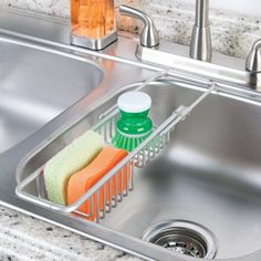 a sink that has some cleaning products in it