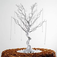 a cake with icing on it and a tree in the middle that has been decorated