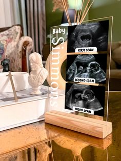 an x - ray shows the baby's first scan and second scan on a table