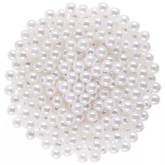 white pearls are arranged in the shape of a ball on a white background, close up