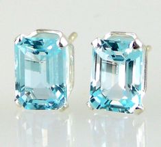 ALL OUR JEWELRY IS HANDCRAFTED IN THE U.S.A. Sweet as sunshine in the spring... These emerald cut Blue Topaz earrings are lovely and versatile. Wear them with your favorite comfy jeans, or dress them up for a night out. Treat yourself... or someone special. Blue Topaz, Emerald Cut, (2) 7x5mm, 2.32 carats total weight E77BT Emerald Cut Stud Earrings, London Blue Topaz Earrings, Emerald Earrings Studs, Smokey Topaz, Comfy Jeans, Emerald Cut Rings, London Blue Topaz Ring, Blue Topaz Earrings, Square Stud