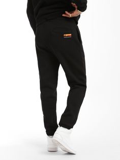 Our signature sweatpant takes traditional sweats to the next level. A soft-brushed cotton blend and streamlined fit give these a plush, put-together look and feel. Built for comfort and function, featuring an easy-on, easy-off elastic waistband with a drawstring and plenty of pocket space. Make it a set with our signature BKLYN hoodie. Measurements based on a size Large. 13.8” front rise 17.3” back rise 9.4” knee 5.1” leg opening B0010170-80018: 50% Cotton, 50% Polyester B0010170-900: 82% Cotton Cotton Jogging Pants With Logo Detail, Sporty Black Cotton Sweatpants, Black Logo Sweatpants For Loungewear, Cotton Stretch Tracksuit With Pockets, Stretch Cotton Tracksuit With Pockets, Black Sweatpants With Logo Detail For Loungewear, Black Cotton Sportswear Sweatpants, Black Cotton Sweats For Jogging, Black Cotton Sweatpants Sportswear