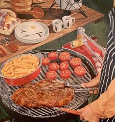 a man cooking food on top of a bbq grill next to a picnic table