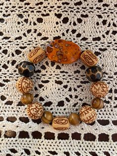 Fall Color Bracelet Set.  Orange, Brown and Black Bracelet Set.   Perfect for Fall. Bohemian Brown Wristlet For Gift, Brown Hand Wrapped Stretch Bracelet For Gift, Brown Hand Wrapped Stretch Bracelet Gift, Handmade Brown Bracelets For Crafting, Brown Bracelet Wristlet, Handmade Bohemian Brown Wristband, Bohemian Handmade Brown Wristband, Handmade Spiritual Brown Stretch Bracelet, Brown Bangle Bracelet For The Beach