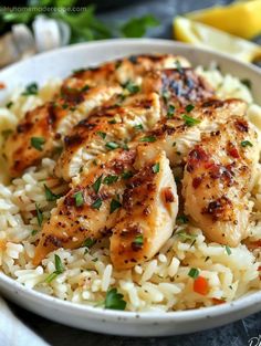 a white bowl filled with rice and chicken