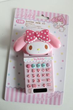 a cell phone with a pink bow on it's head and numbers in the front