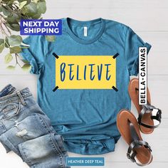 "Believe Shirt, Motivational Sport T-shirt, Ted Shirt, Team Tee, Believe T-shirt, Lasso Believe Shirt, Lasso Gift Hi! Welcome NeoTeeApparel. It's great to see you here! ☺️  Our shirts are clean, high quality and soft. It is prepared quickly by our boutique.  Ironing and shipped.  Enjoy your shopping!  It is a pleasure for us to help you with your questions and you can reach us at any time.  Please, don't forget to check our size cards. HOW TO ORDER SHIRT 👕  Please, choose your favorite t-shirt Ted Lasso Svg Free, Comfortable Blue T-shirt With Graphic Print, Blue T-shirt With Graphic Print, Comfortable Fit, Comfortable Fit Blue T-shirt With Graphic Print, Basic Blue T-shirt With Slogan, Ted Lasso Shirt, Believe Ted Lasso, Ted Lasso, Text Shirt