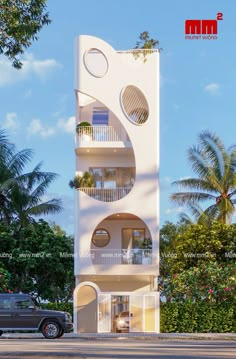 a tall white building with multiple balconies on the top and second story, surrounded by palm trees