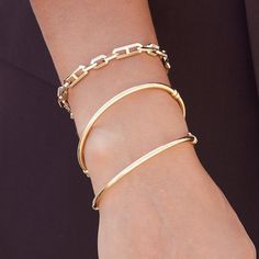 Get ready to stack up because classic bangles are back in a big way! Our Classic Oval Tube Bangle is the perfect daily wearer that combines sophistication with style. A 14K Gold hollow tube makes this lightweight for all day wear but full of radiant shine. THE perfect sleek width to layer with other bangles or chain bracelets from Babygold.

Size: 3mm Round
Inside Dimension: 60mm(W) x 50mm(H)
Fits 6.5"-7.5” wrist
Spring Lock Mechanism
14K Solid Gold
Lifetime Guarantee
Made in Los Angeles Modern Hoop Bangle For Everyday, Modern Hoop Bangle For Everyday Wear, Elegant Hoop Cuff Bracelet For Everyday, Modern Bangle For Everyday Luxury, Elegant Flexible Bangle For Everyday Wear, Sleek Gold Bangle Bracelet, Sleek Everyday Bangle Bracelets, Sleek Everyday Bangle Bracelet, Modern Stackable Bangle Chain Bracelet