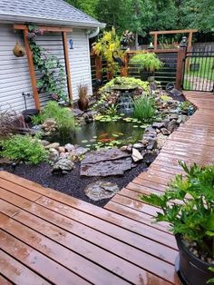 a small pond in the middle of a wooden deck