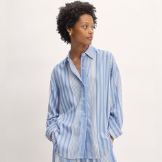 This Piece Features An Oversized Fit, Shirt Collar, Front Button Closure And Cuffs, Long Sleeves, And Shirttail Hem. New, Never Worn Excellent Condition Despite Wrinkles 100% Tencel Lyocell Care Machine Wash Cold With Like Colors. Only Non-Chlorine Bleach When Needed. Tumble Dry Low. Cool Iron When Needed. Relaxed Blue Blouse For Spring, Oversized Blue Button-up Shirt, Oversized Blue Shirt With Button Closure, Relaxed Blue Tops For Daywear, Blue Blouse With Shirttail Hem For Daywear, Striped Oversized Button-up Blouse, Oversized Striped Button-up Blouse, Relaxed Blue Button-up Shirt, Relaxed Blue Summer Blouse