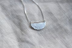 Lovely everyday necklace in a 'half moon' shape. Handmade in recycled silver with a hammered and textured finish giving an organic quality. Perfect for everyday wear. Measures approximately 18mm at the widest point and comes on a 45cm silver curb chain. Comes in a Darte branded gift box which is made from 100% eco-friendly cardboard. Perfect for giving jewellery as a gift or for storing your jewellery in. All jewellery is handmade by me. Although I try to keep consistency across each product, please note your piece may vary very slightly to the picture shown. Organic Jewellery, Silver Necklace Pendant, Organic Jewelry, Small Circle, Jewelry Workshop, Moon Shape, Everyday Necklace, Silver Jewelry Handmade, Recycled Silver