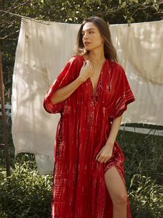 Switch to vacay mode anytime with the Goddess - Tie Dye Kaftan Maxi Dress in red coral. This undeniably sexy, breezy maxi dress will have you dreaming of the wind in your hair, the sound of the ocean waves, and the sand under your feet. Experience blissful comfort and breathability whether you’re at home or on vacay with the gorgeous flowy long dress and laid-back loose fit. Crafted in 100% soft, lightweight rayon, this dress features flawless tie-dye patterns and is perfect for tropical beachsi Red V-neck Dress For Vacation, Red V-neck Beachwear Dress, Breezy Rayon V-neck Maxi Dress, Red V-neck Maxi Dress For Beach Party, Red V-neck Beach Dress For Spring, V-neck Red Beach Dress For Spring, Flowy V-neck Maxi Dress For Holiday, Red V-neck Vacation Dress, Red Beachwear Midi Dress For The Beach