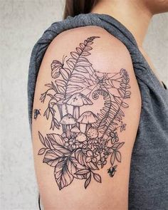 a woman with a flower tattoo on her arm