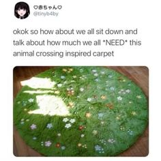 a green cake with flowers on it sitting on top of a wooden table