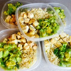 four plastic containers filled with rice, broccoli and other food items on a table