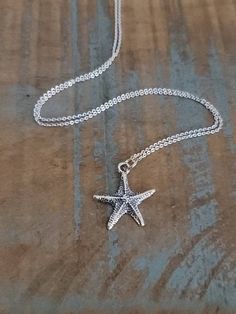 Cute starfish charm necklace perfect for those beach days! Made of Solid 925 Sterling Silver.  This oxidized, detailed Sterling Silver Starfish charm measures 3/4 inch   Sterling Silver Cable or Box chain: you choose style & length Necklace arrives in a beautiful necklace gift box ready for gift giving To ADD a Swarovski Birthstone charm, use the link below: https://www.etsy.com/ForeverMemoryDesigns/listing/1061875218/birthstone-charms-6mm-swarovski?utm_source=Copy&utm_medium=ListingManager&utm_campaign=Share&utm_term=so.lmsm&share_time=1636678314977 To see more of our shop, use the link below:   http://www.etsy.com/shop/forevermemorydesigns Beach Starfish Charm Necklace, Star Charm Necklace For Beach, Star Charm Necklaces For Beach, Adjustable Necklace With Starfish Charm, Sterling Silver Starfish Charm Necklace, Sterling Silver Starfish Necklace With Star Charm, Sterling Silver Necklace With Starfish Charm, Beach Jewelry With Sterling Silver Star, Adjustable Silver Starfish Necklace