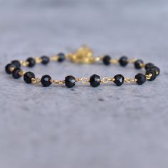 ✦ Discover the power of black onyx with our delightful faceted beaded bracelet. Add a touch of sophistication to any outfit with this stunning black onyx Rosary chain bracelet. It looks like something your favorite A-lister would wear! These beads are said to offer protection against negative energy and ground you, helping to promote self-control whilst still remaining an essential accessory. Make sure to grab one before they're gone - every fashionista needs one of these statement pieces in the Elegant Black Rosary Bracelet With Round Beads, Elegant Black Bracelets With Faceted Beads, Black Beaded Bracelet As Gift, Black Beaded Chain Bracelet For Gift, Gift Black Beaded Chain Bracelet, Elegant Handmade Black Chain Bracelet, Elegant Black Crystal Bracelet With Faceted Beads, Black Onyx Beaded Bracelets With Faceted Beads, Elegant Onyx Bracelets With Faceted Beads