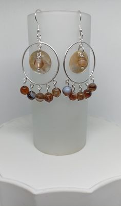 Boho styled, sterling silver dropper earrings with shell accents and semi-precious coffee agate beads The earrings are made in sterling silver with their own gift box. If you have any enquires regarding this item, please feel free to message. Elegant Beaded Agate Earrings, Silver Sterling Chandelier Earrings With Natural Stones, Silver Bohemian Agate Earrings, Bohemian Silver Agate Earrings, Silver Agate Earrings With Natural Stones, Nickel-free Silver Agate Earrings, Dangle Earrings With Natural Agate Stones, Agate Dangle Earrings With Natural Stones, Elegant Silver Agate Earrings