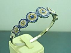 Material= 925 Sterling Silver Stone/Stones=Sapphire&Citrine&Zircon Style= Eastern Bangle Width (mm)=18x55 Wrist Diameter(mm)=56x60 Weight(gr)=10,9 Coating=None Item Specify=Evil Eye Design Evil Eye Design, Womens Bangles, Stone Bangle, Eye Design, Sapphire Stone, 925 Jewelry, Evil Eye, Citrine, Bangle Bracelets