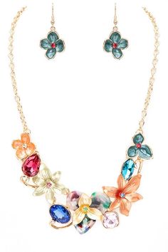 This Flower Bib Necklace Set is the perfect statement accessory. The 16" necklace features a lobster clasp closure and colorful enamel design with multicolor faux stones. The 1.65" drop earrings have fishhook closures. Both pieces are expertly crafted and sure to elevate any outfit. Lead & Nickel Compliant Photo may have been enlarged and/or enhanced. Hair Gift, Denim Short Dresses, Gold Necklace Set, Faux Stone, Enamel Flower, Bib Necklace, Sweater And Shorts, Hat Hairstyles, Fashion Set