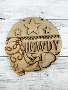 a wooden plaque with the words, howdy and stars in it on a white wood background